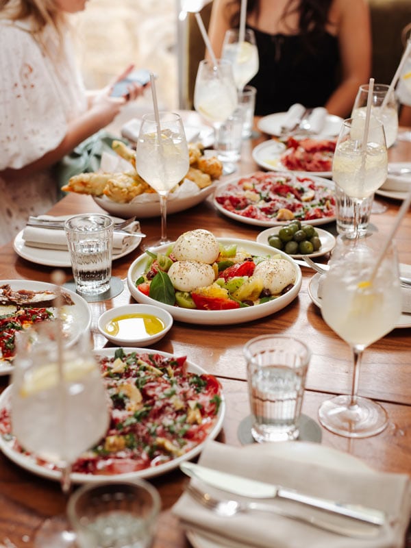 Limoncello and dishes from bottomless brunch at Mille Vini