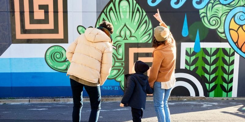 Family admire street art in Braddon Canberra