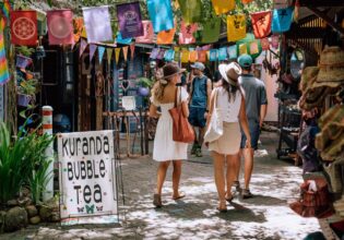 friends walking through the Original Rainforest Markets in Kuranda
