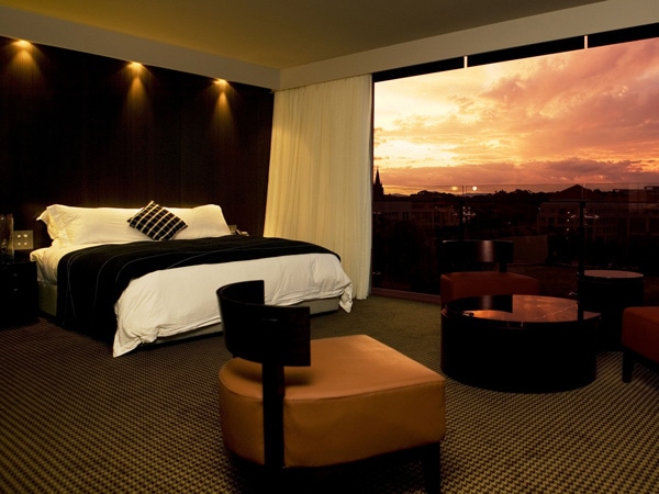 a bedroom with sunset views at Hotel Realm