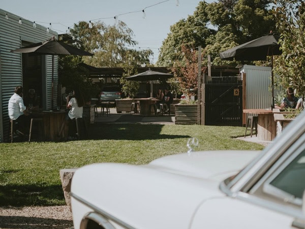 a vintage car stopping by Musk Lane Wine, Daylesford