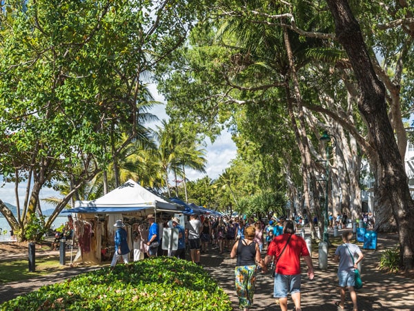 people strolling along the stalls at Palm Cove Markets