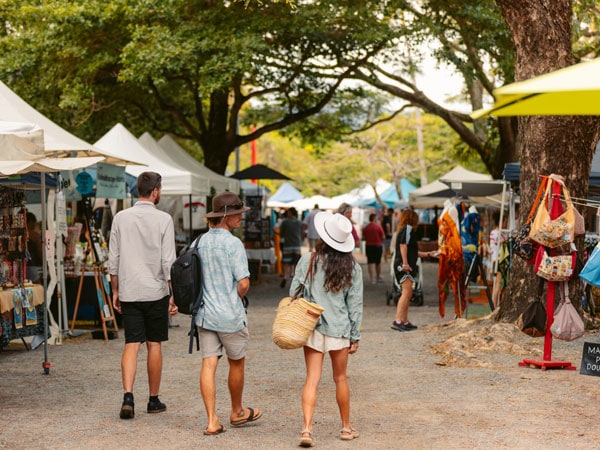 friends strolling along the stalls at Port Douglas