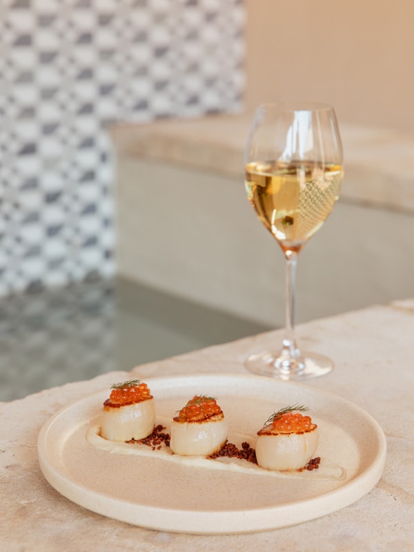 The seared scallop, cauliflower cream, chorizo crumb, salmon roe, and smoked extra virgin olive oil at Tower Lodge