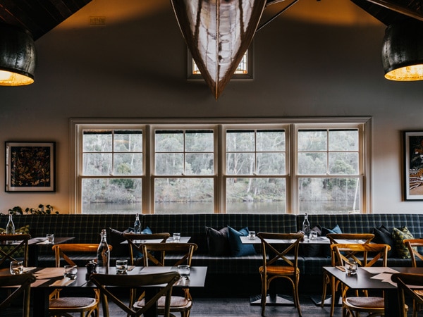 a dimly lit dining interior at The Boathouse Restaurant, Daylesford