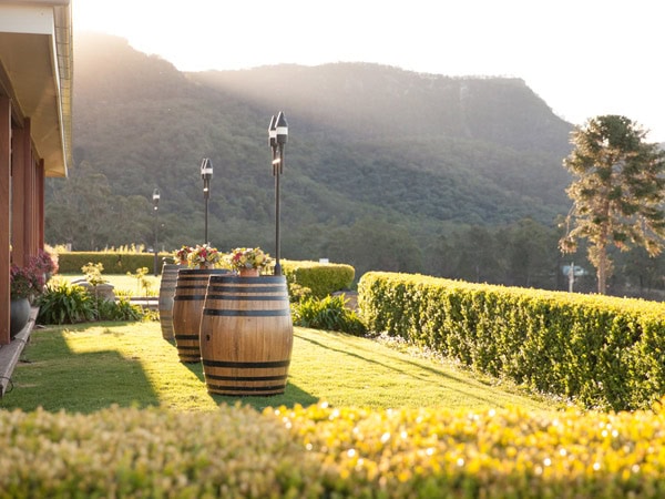 wine barrels on the scenic grounds of Audrey Wilkinson, Hunter Valley