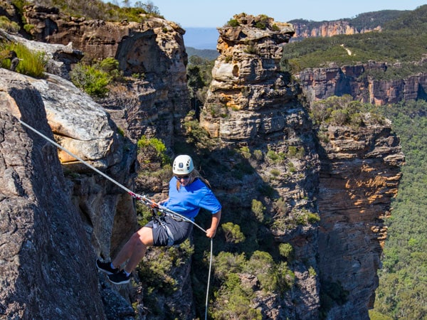 a woman abseiling at Cahills Lookout, Katoomba in the Blue Mountains