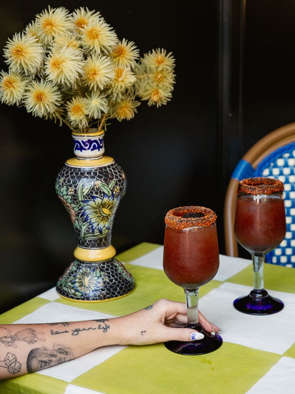 a hand reaching for drinks at Clay Cantina, Coolangatta