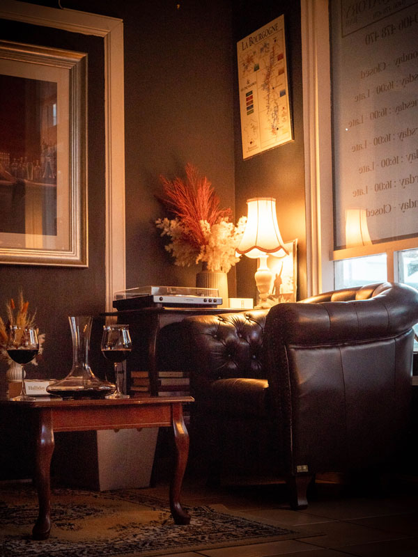 a dimly lit corner at Conservatory Bar, Cairns