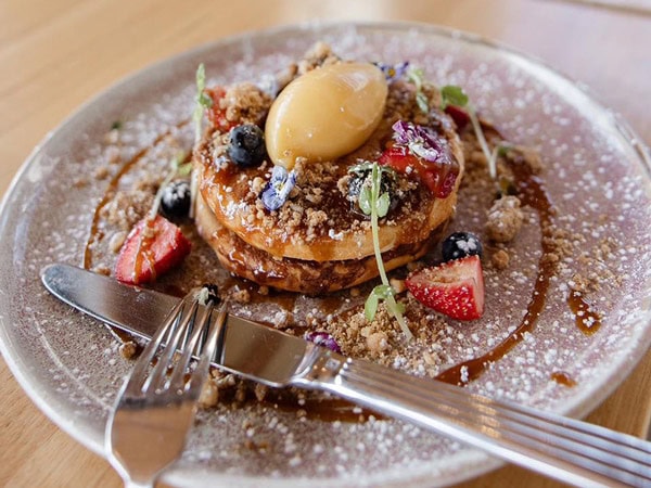 fluffy buttermilk pancakes on a plate at Goodfriends Eatery, Newcastle 