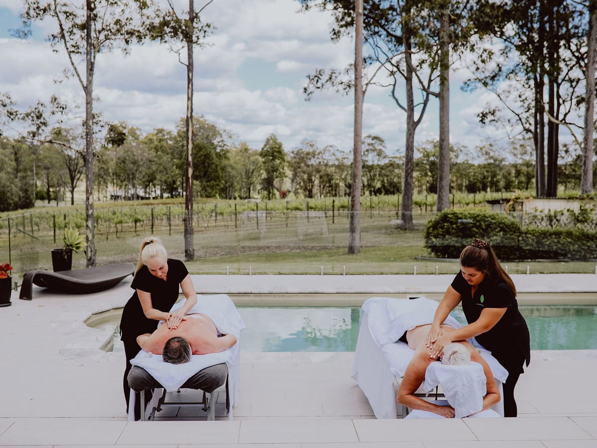 two people undergoing massage treatments by the pool at Nu Leaf Retreat, Hunter Valley