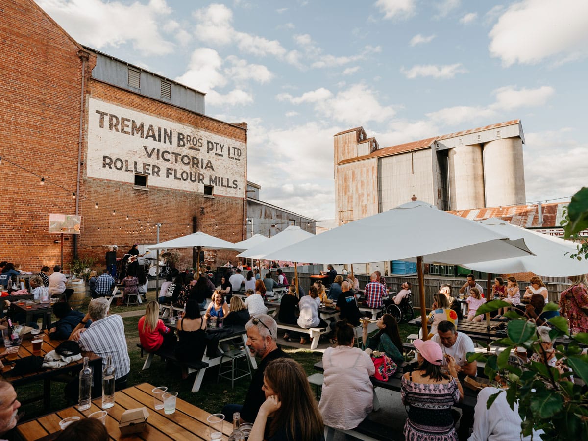 the Backyard and Tremains Mill filled with people dining at The Victoria pub, Bathurst