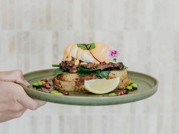 a hand holding a breakfast plate at Mr O Wholefoods, Hunter Valley