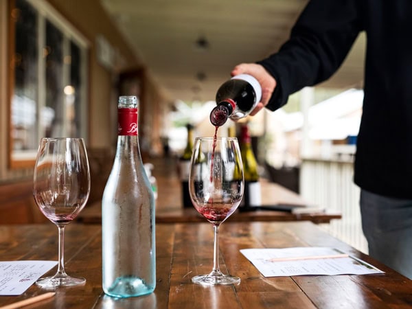 pouring wine into a glass at Briar Ridge Estate