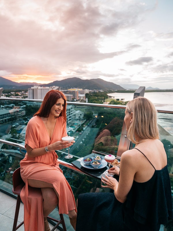 two women enjoying drinks at Rocco by Crystalbrook