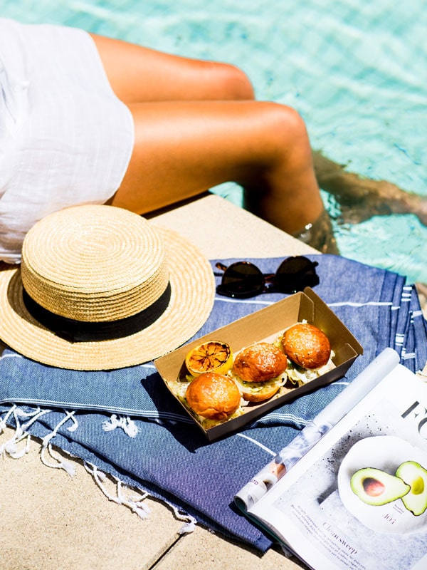 a close-up photo of food by the pool