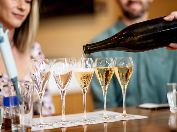pouring wines at The Art of Sparkling at Josef Chromy, Australian Traveller Mega Holiday Giveaway