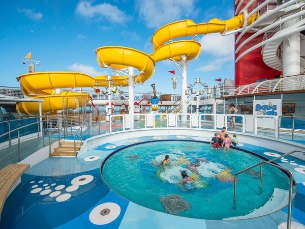 Families playing in the pool at AquaLab onboard Disney Wonder
