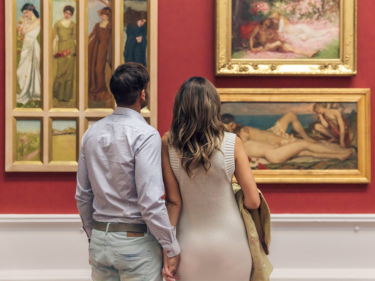 couple walking through Art Gallery of South Australia