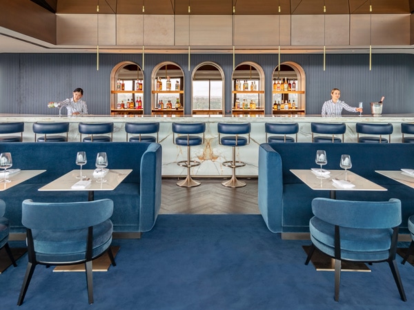 the warm blue bar interior of Aster, Sydney, NSW