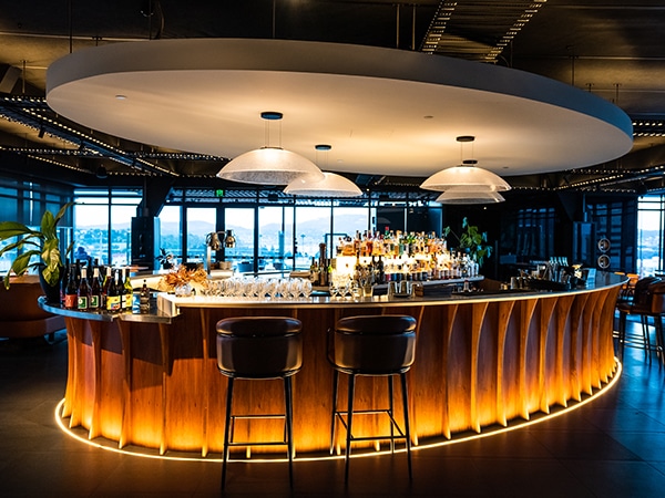 Auru Rooftop Bar is cast in a golden light in Hobart.
