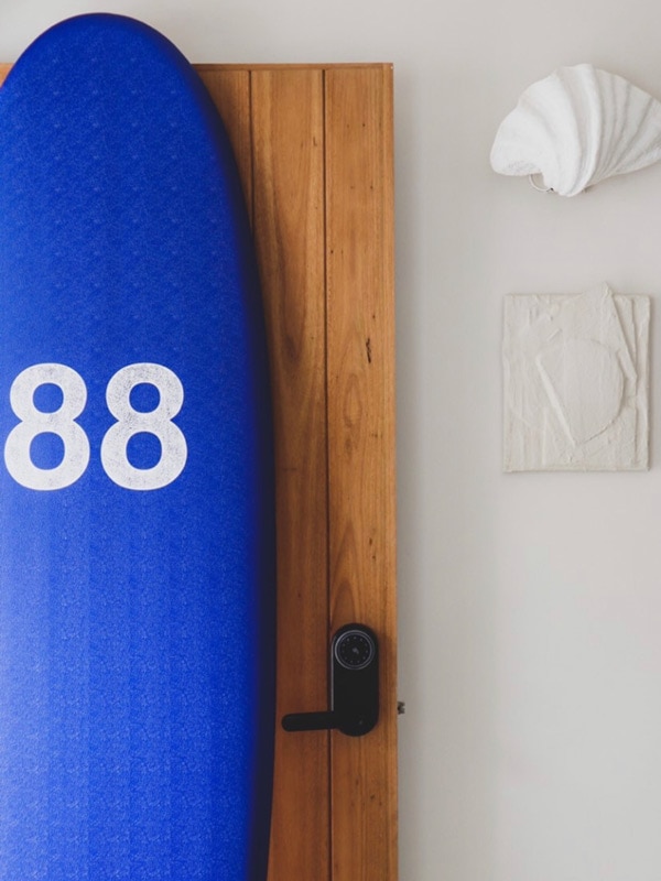 a surfboard hanged on the wall at Blue Water Motel Kingscliff