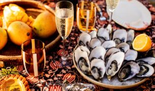 A spread of mangoes, oysters and champagne