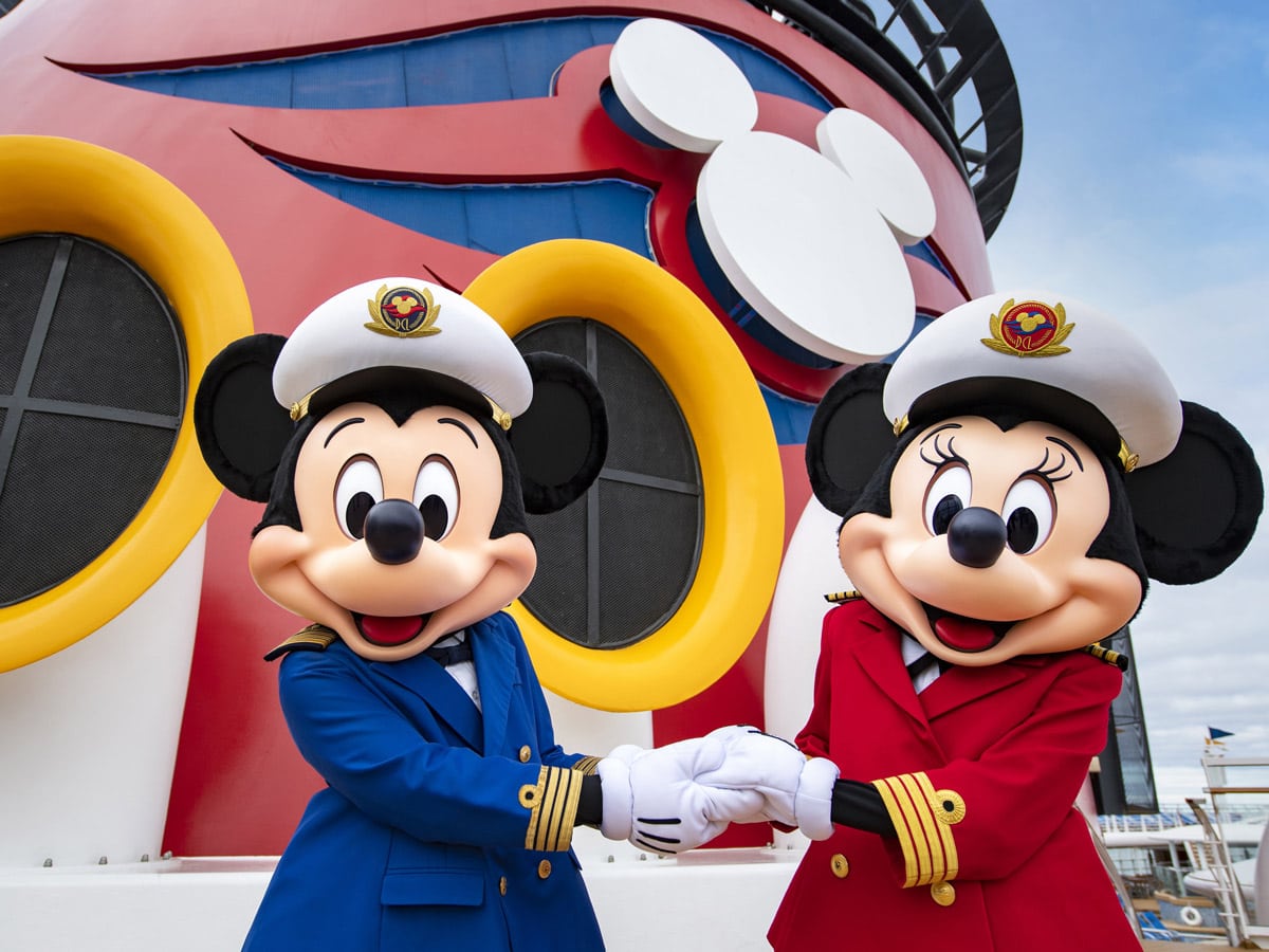 Captains Mickey Mouse and Minnie Mouse at funnel of Disney Wonder cruise ship