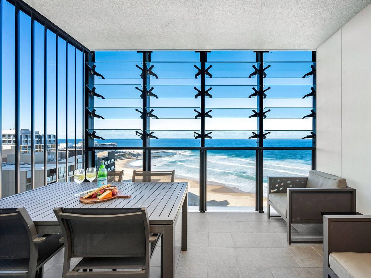 dining with views of Newcastle beach at Executive Beach Apartment