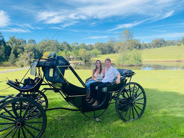 a couple riding a carriage, Hunter Valley Classic Carriages