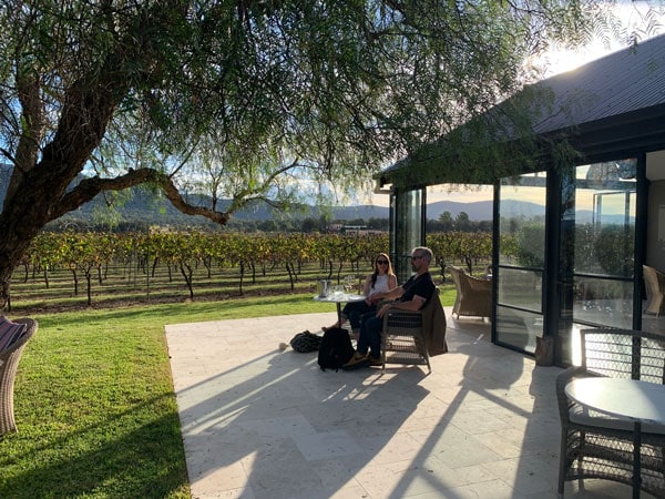 a couple sitting in front of a scenic vineyard, Hunter Valley Tours For Two