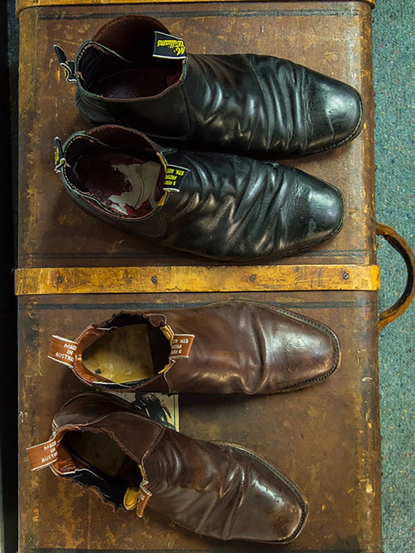 a table-top view of two pairs of R.M. Williams boots