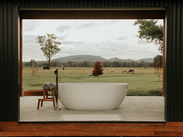 an outdoor tub with a scenic view at Laurina Estate