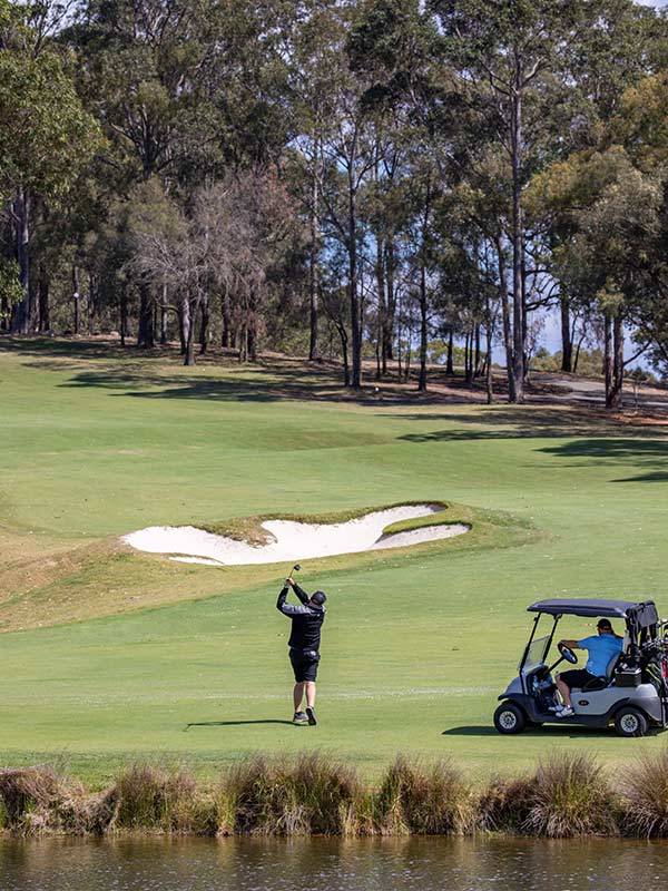 Man enjoying a round of golf at Cypress Lakes Golf & Country Club, Pokolbin.