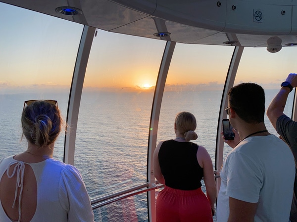 passengers enjoying the sunset on a paid North Star experience on a sea day