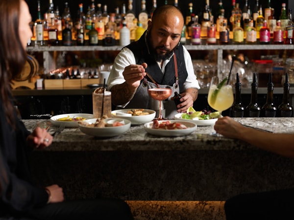 a bartender preparing drinks at Romberg’s Bar, Newcastle, NSW