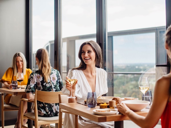 a woman enjoying drinks at SkyCity's Sol Bar and Restaurant