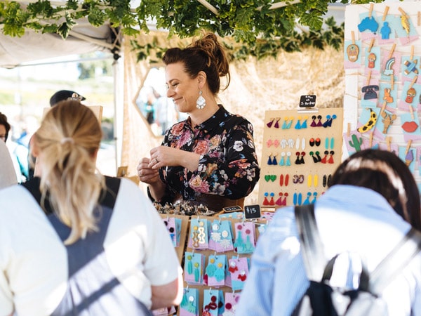 people shopping at a jewellery stall at Olive Tree Markets, Newcastle