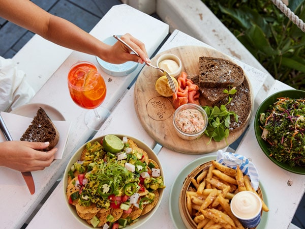 A table full of meals ordered at The Boathouse Hotel Patonga