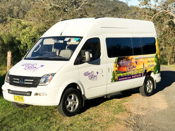 an air-conditioned van provided by Wine D Road Tours