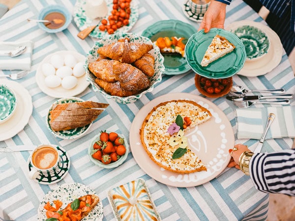 dining table with food on Alex and Trahanas ceramics