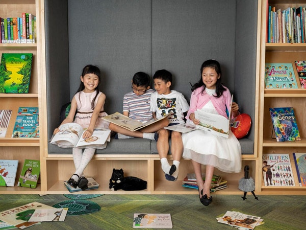 kids having fun in the reading corner at Children's Library, Sydney
