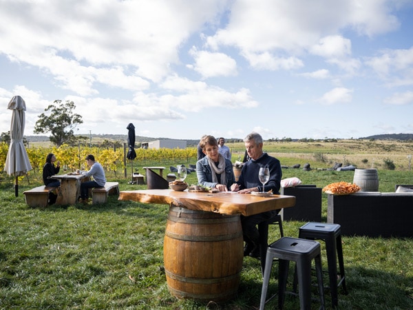 a couple tasting wines at Craigie Knowe Vineyard, Tasmania