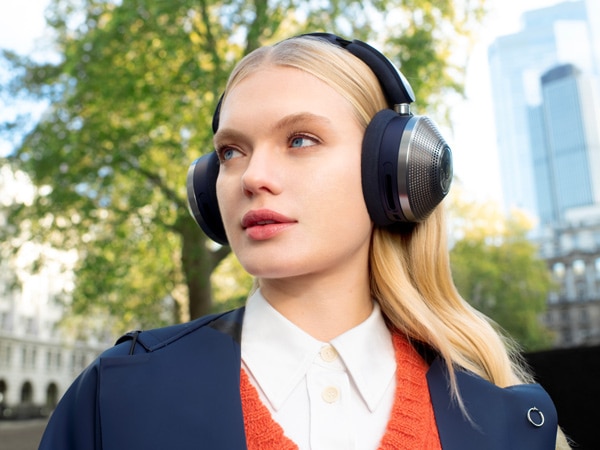 a woman wearing a pair of noise-canceling headphones, Christmas gift ideas