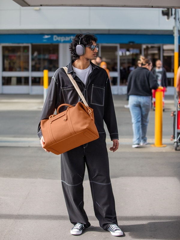 a man posing with MAISON de SABRÉ The Duffle Bag