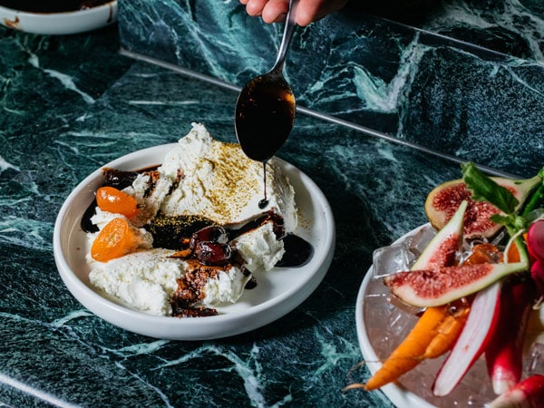 dripping sauce into a dish at Mille Vini Wine Bar & Restaurant, Surry Hills