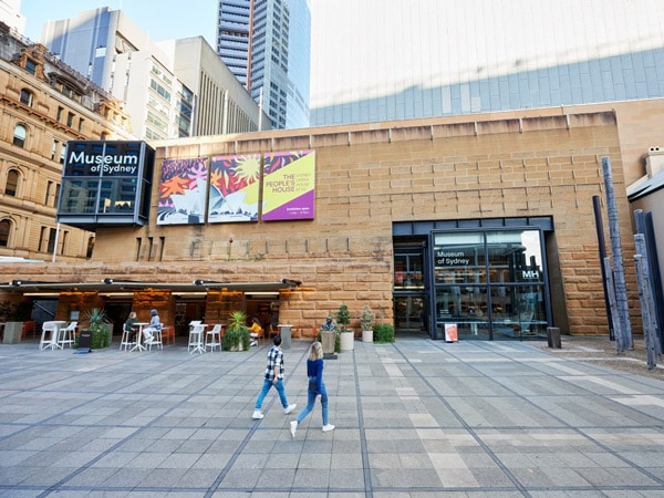 two people entering the Museum of Sydney