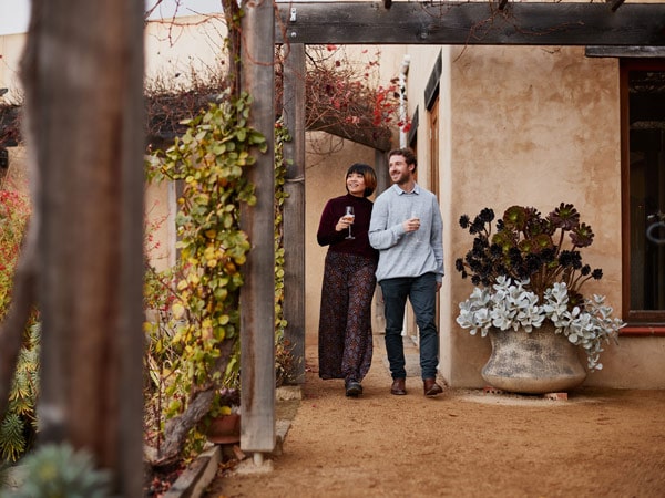 Couple walking at Stefano Lubiana winery in Tasmania