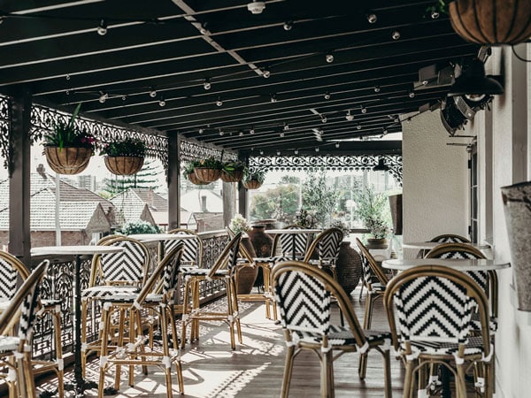 the pub interior of The Exchange with black and white striped chairs