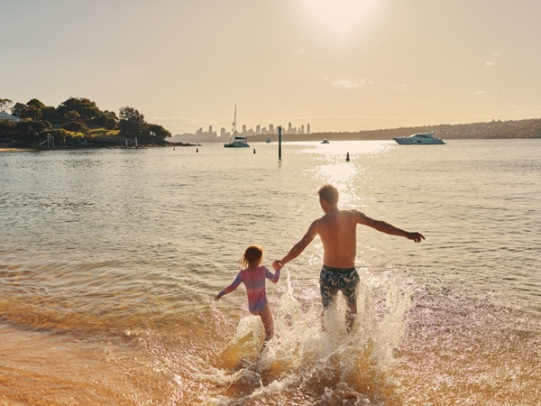father and daughter playing in the water at Camp Cove Beach in Watsons Bay, Sydney